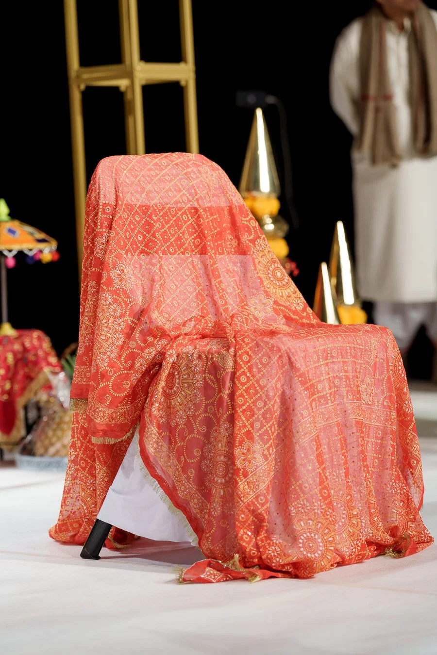 a chair with re silk cover on it