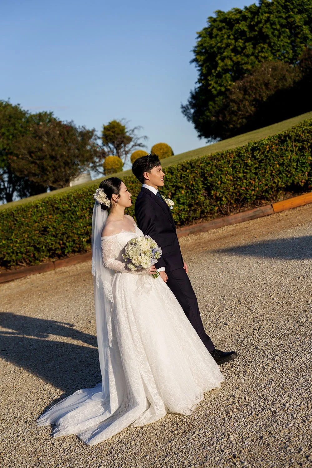 Michael leading Lisa walking towards to the sun