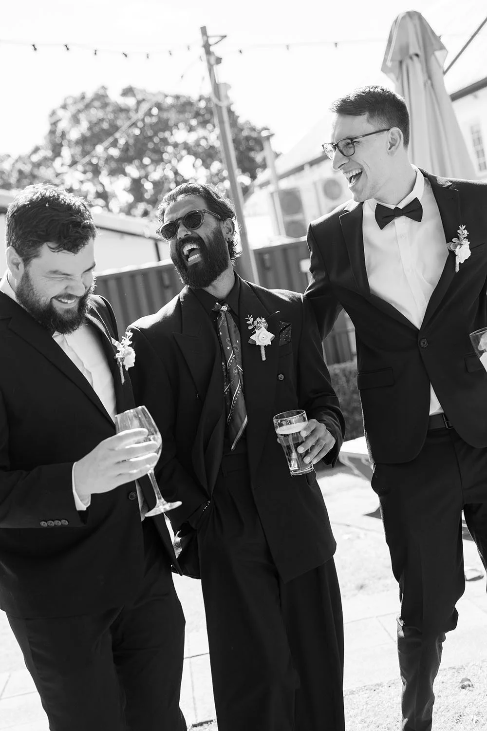 Jay and his groomsmen laughing while waking