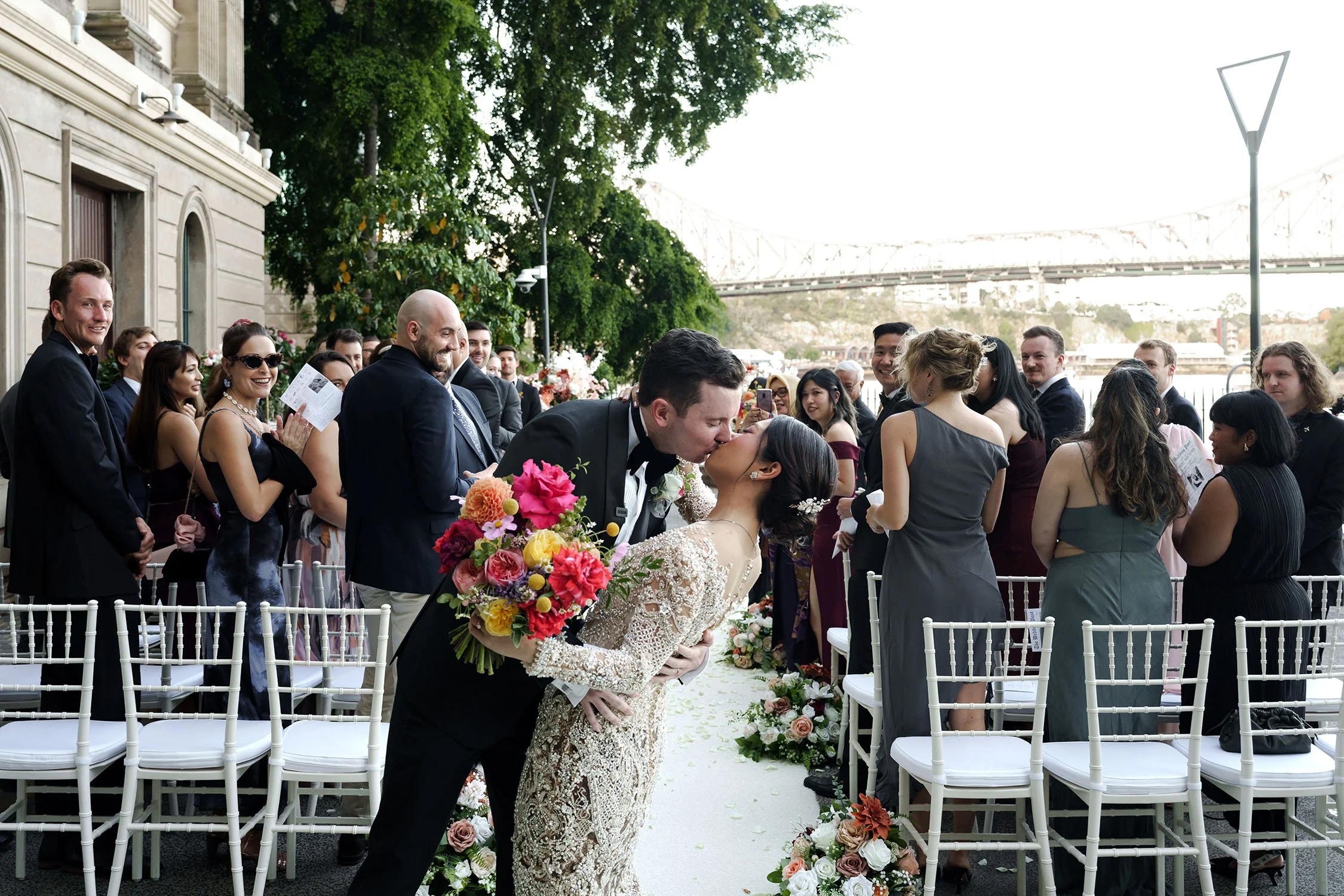 Nori and Cliffe kissing down the aisle