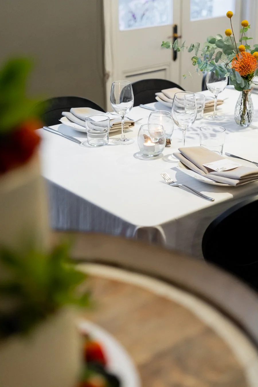 table setting two plates and glasses in transcontinental hotel