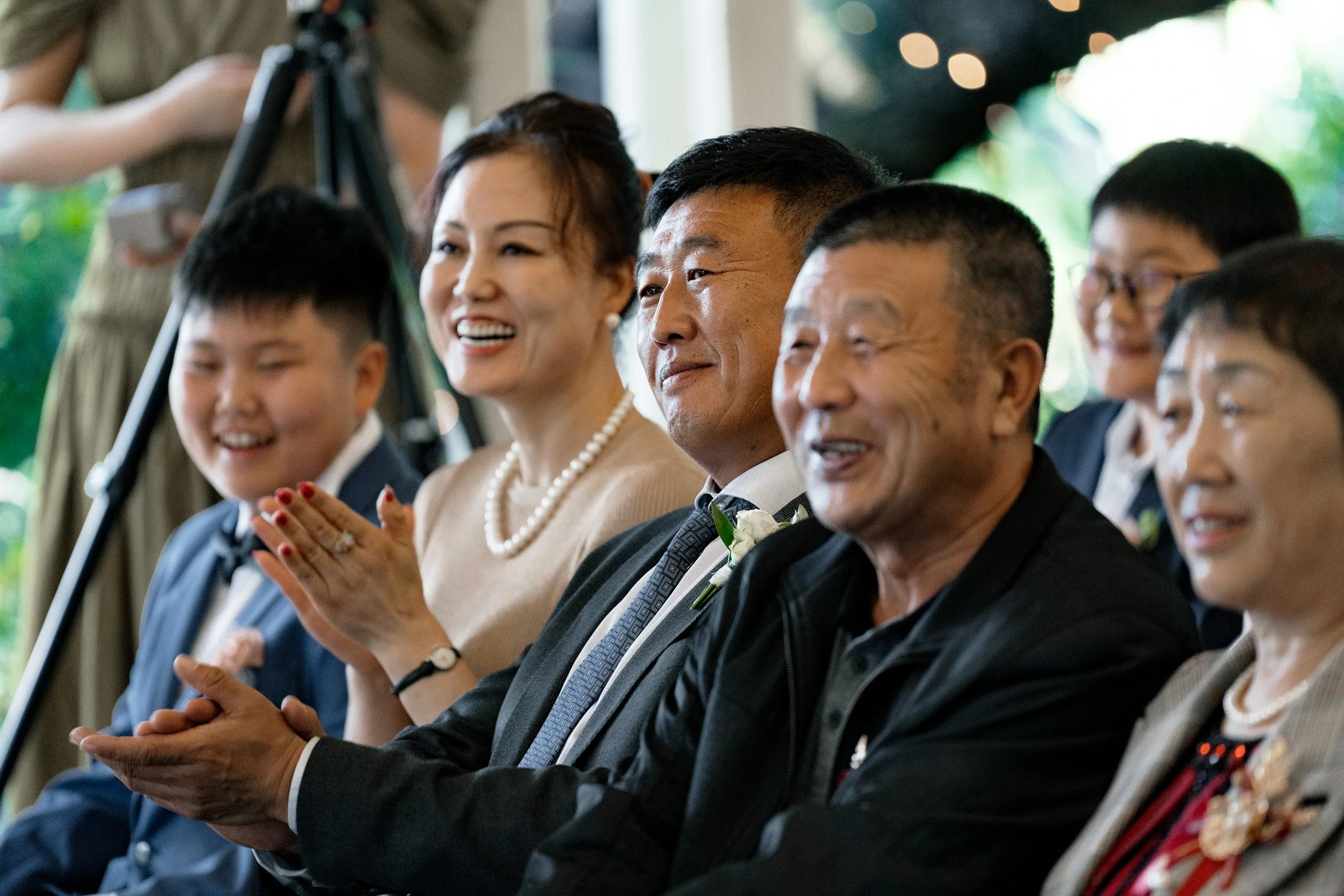 bride's intimidate family smile at ceremony