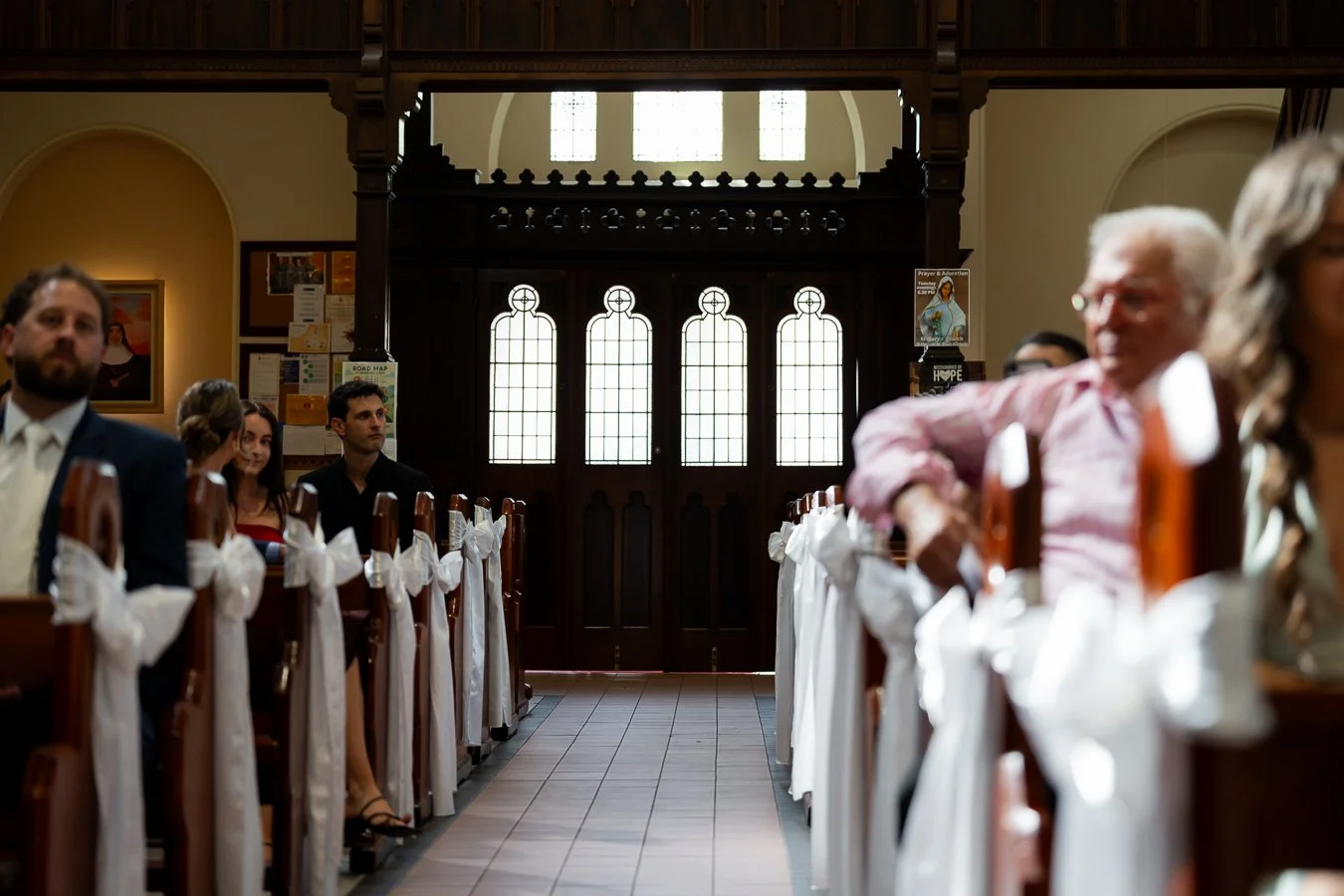 The church doors were closed before bride and hwe father walking into the church