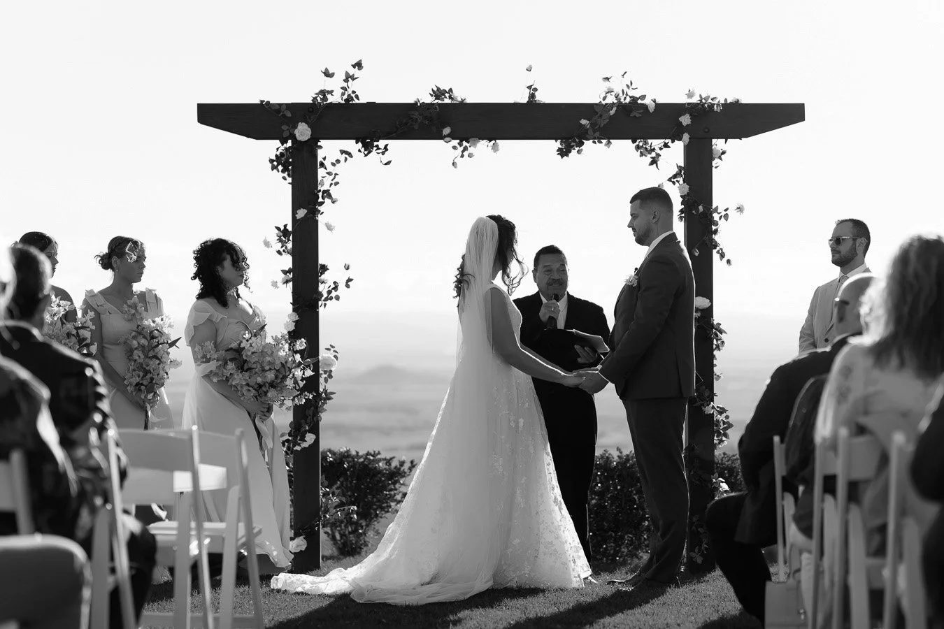 Ben and Chiarra in wedding ceremony standing facing to each other