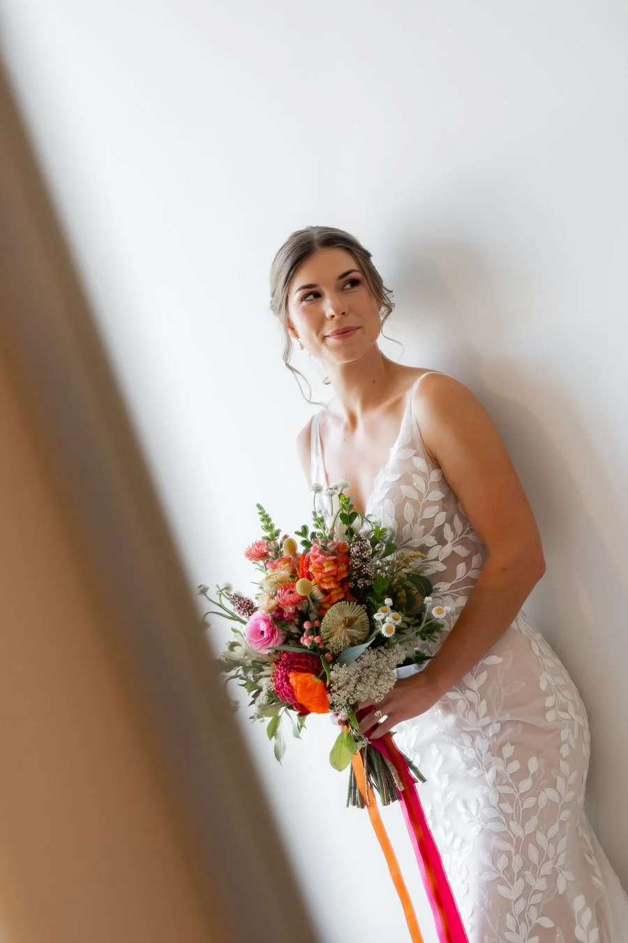 The bride smiled as she looked toward the door