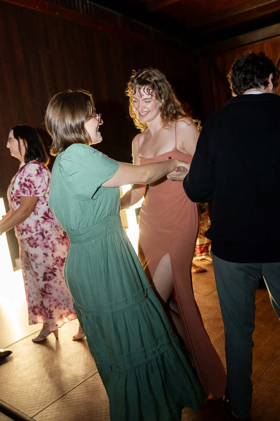 two females hands holding danicng high