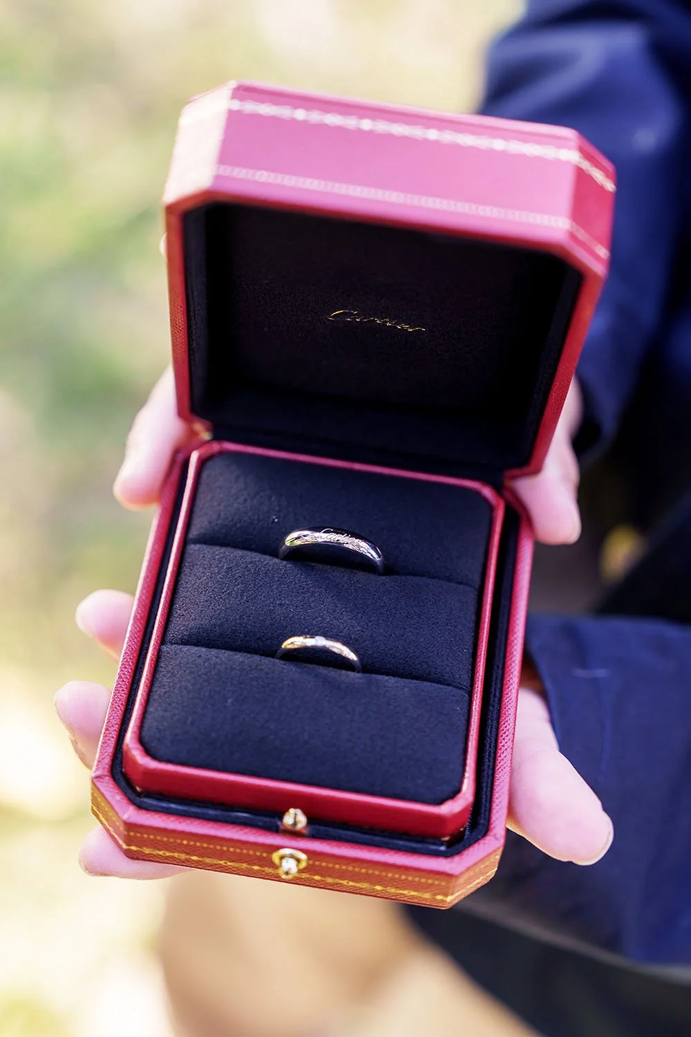 Flora and Eric's wedding rings inside a box