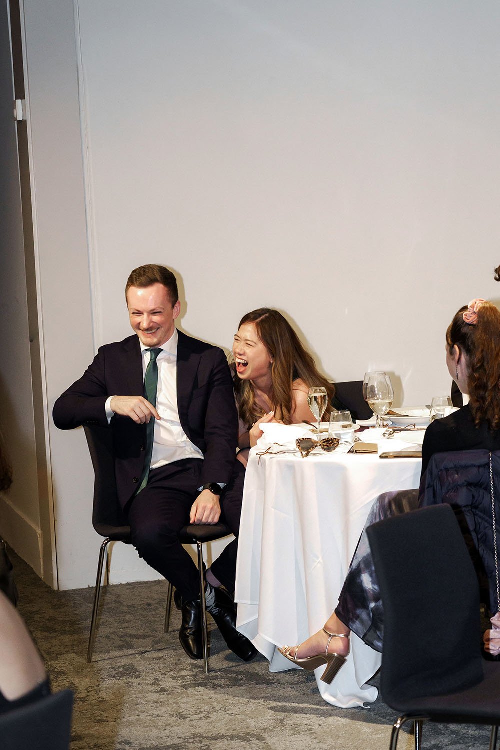 2 guests laughing in the reception