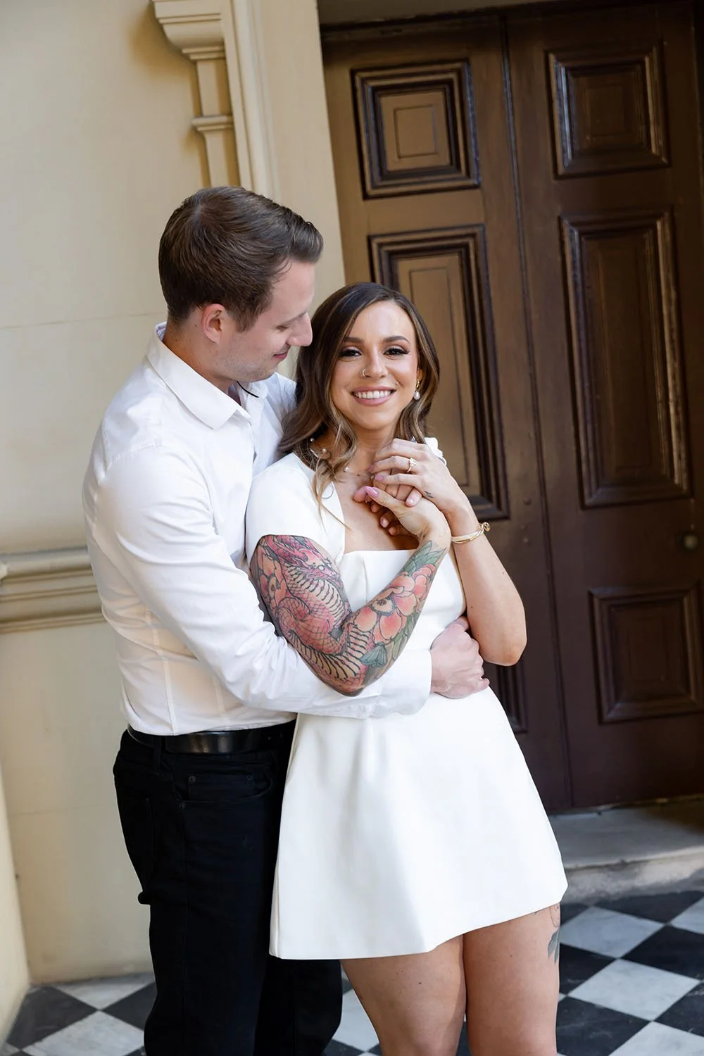 Morgan holding Brenna arm rap around her wist and look her in their engagement photo session, she look the Brisbane wedding photographer Whistler