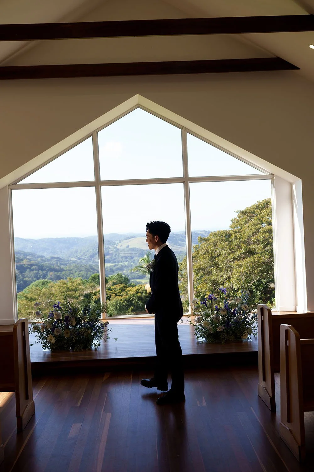 Michael stand in the middle of the the ceremony spot in Summergrove estate