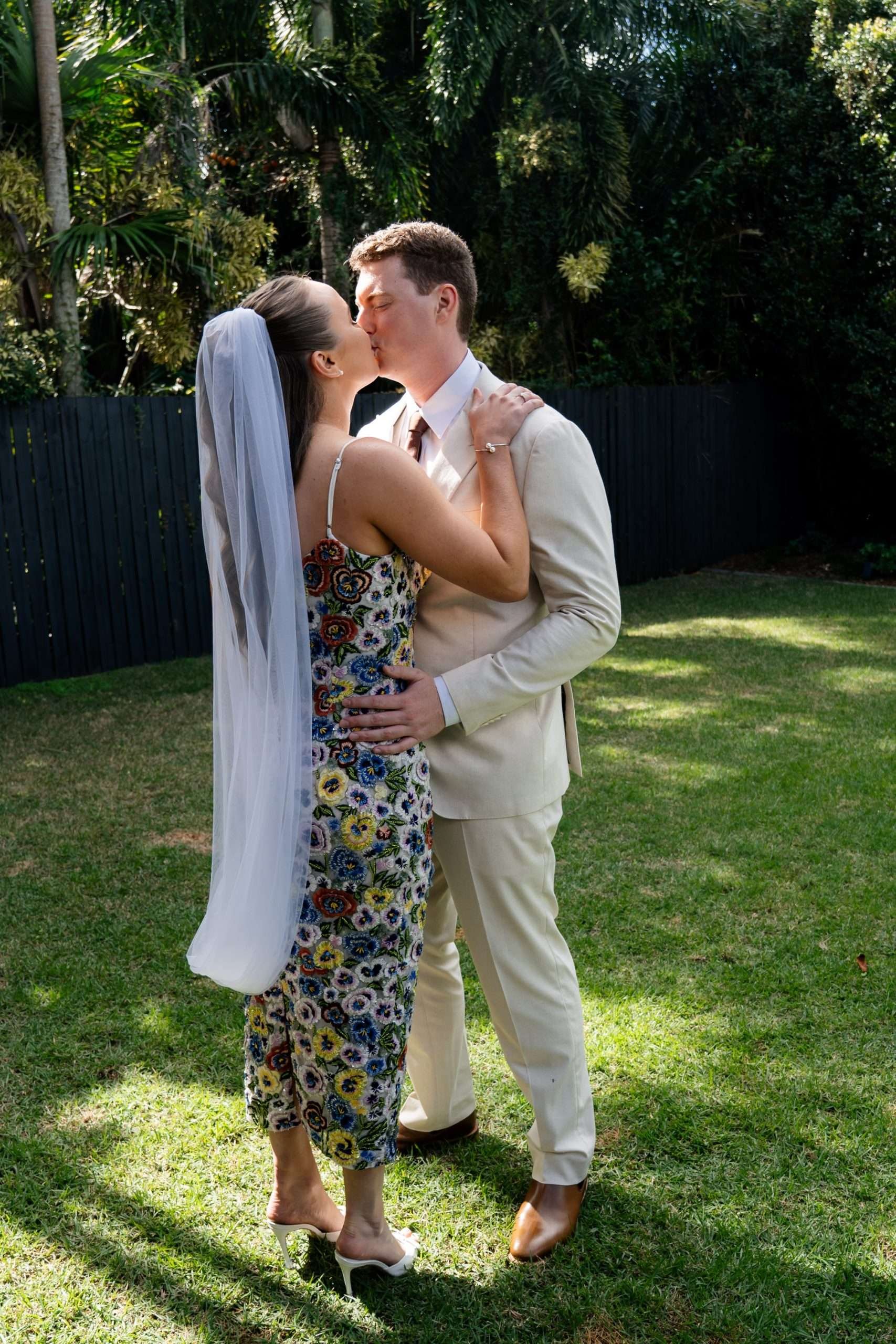 bride and groom kissing after the first look
