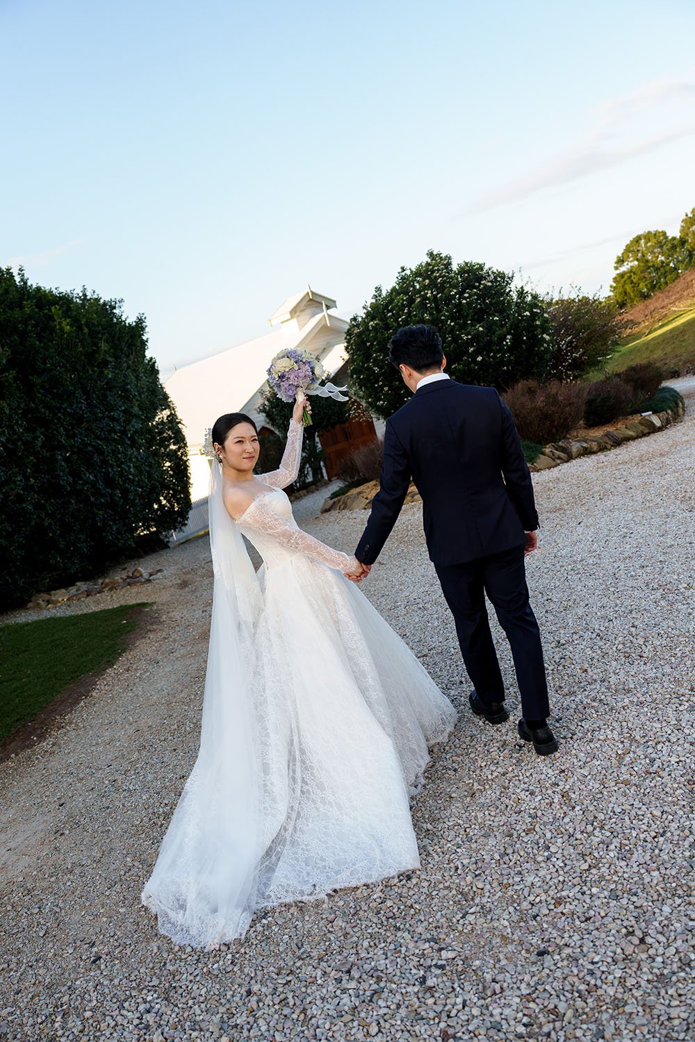 Lisa look back to the Brisbane wedding photographer Whistler Li with her flower up