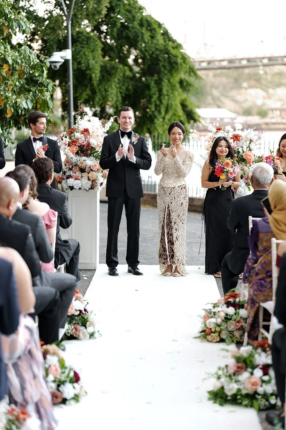bride Nori and groom Cliffe claps