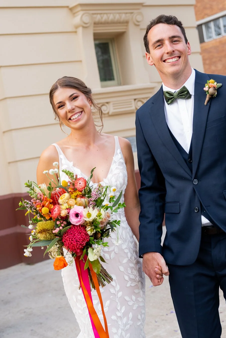 bride and groom hands together smell to the Brisbane wedding photographer Whistler