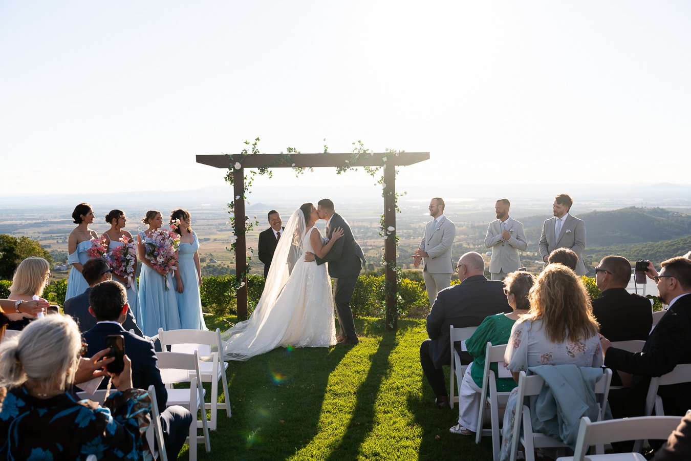 bride Chiarra and groom Ben kissing in their ceremony