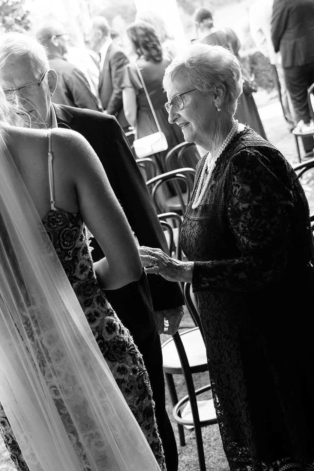 groom's grandparents talk to bride Charlotte