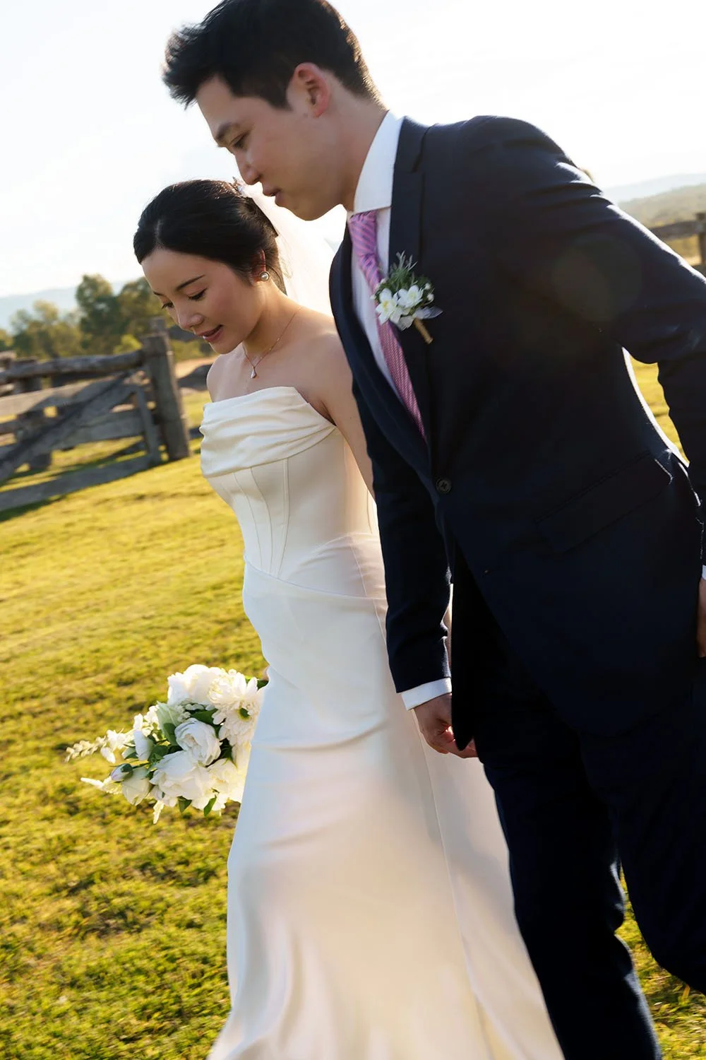 Eric and Flora hands holding lokking down walking