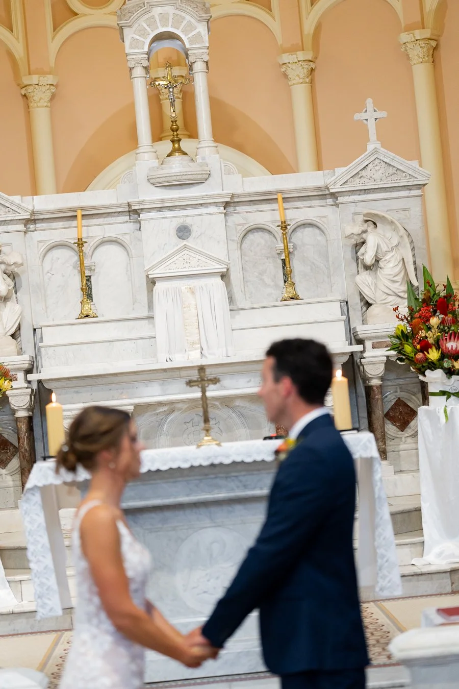 In the distance, the altar features a cross and a horse sculpture