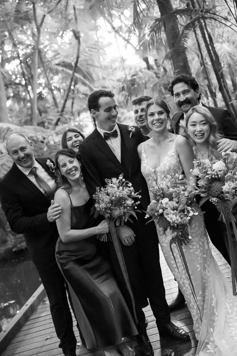 bridal party happily hug each other with joy and smile at the Brisbane photographer Whistler Li