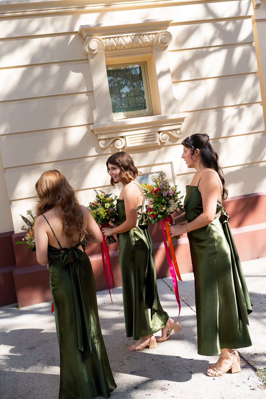 The bridesmaids had arrived, waiting at the front of the church
