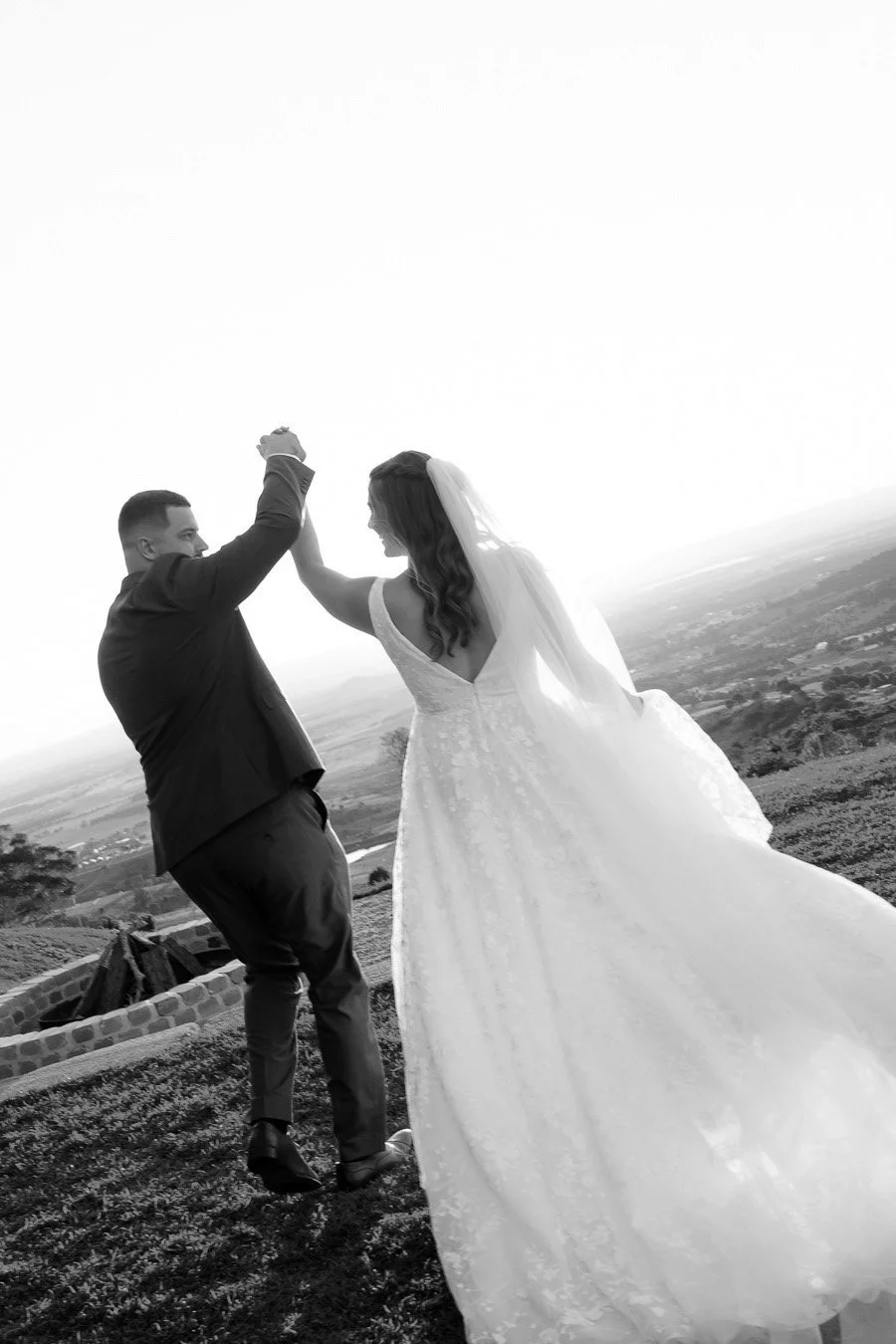 bride Chiarra and groom Ben hands holding together and raise up