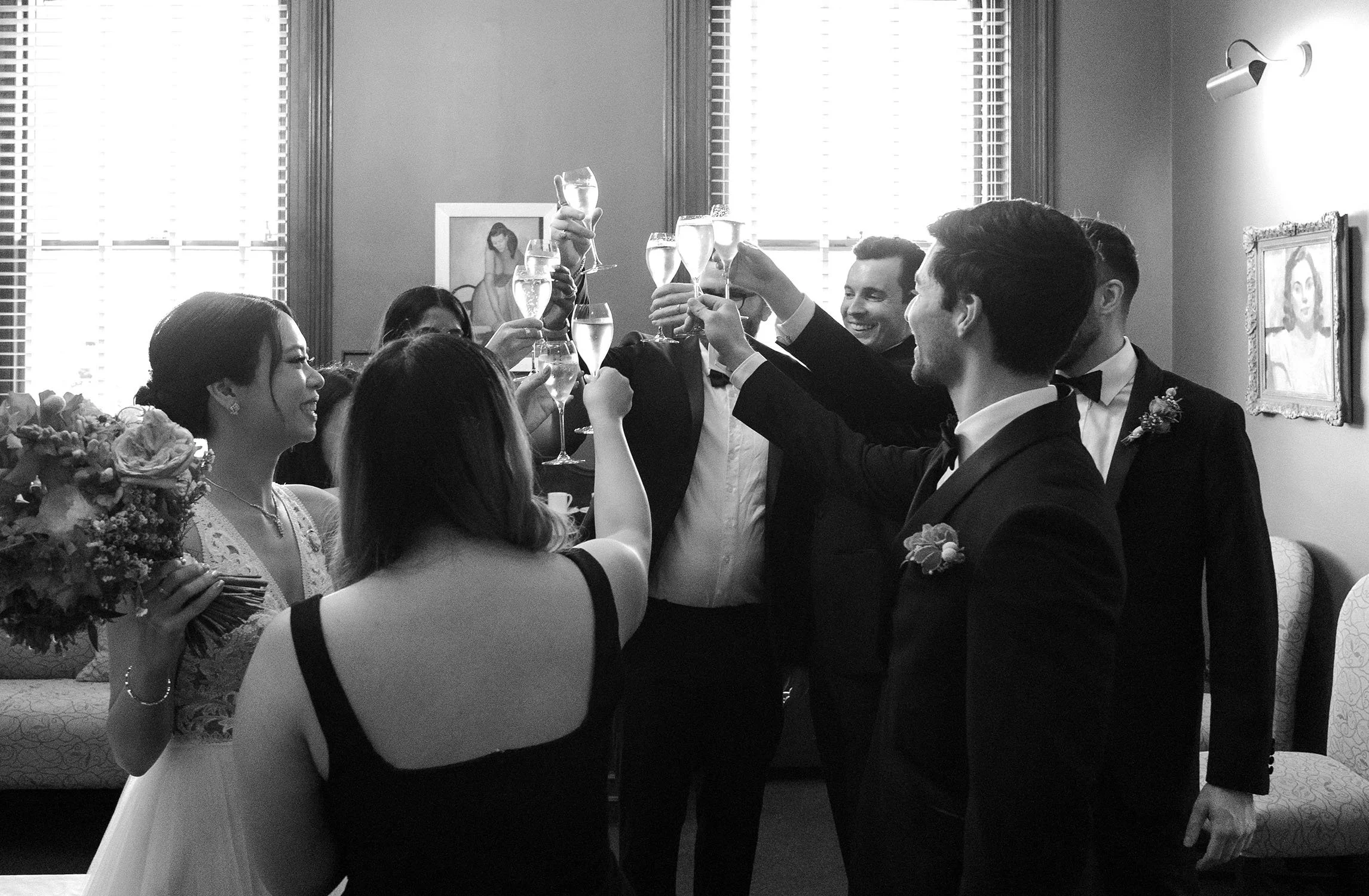 everyone cheers with glasses of champagne