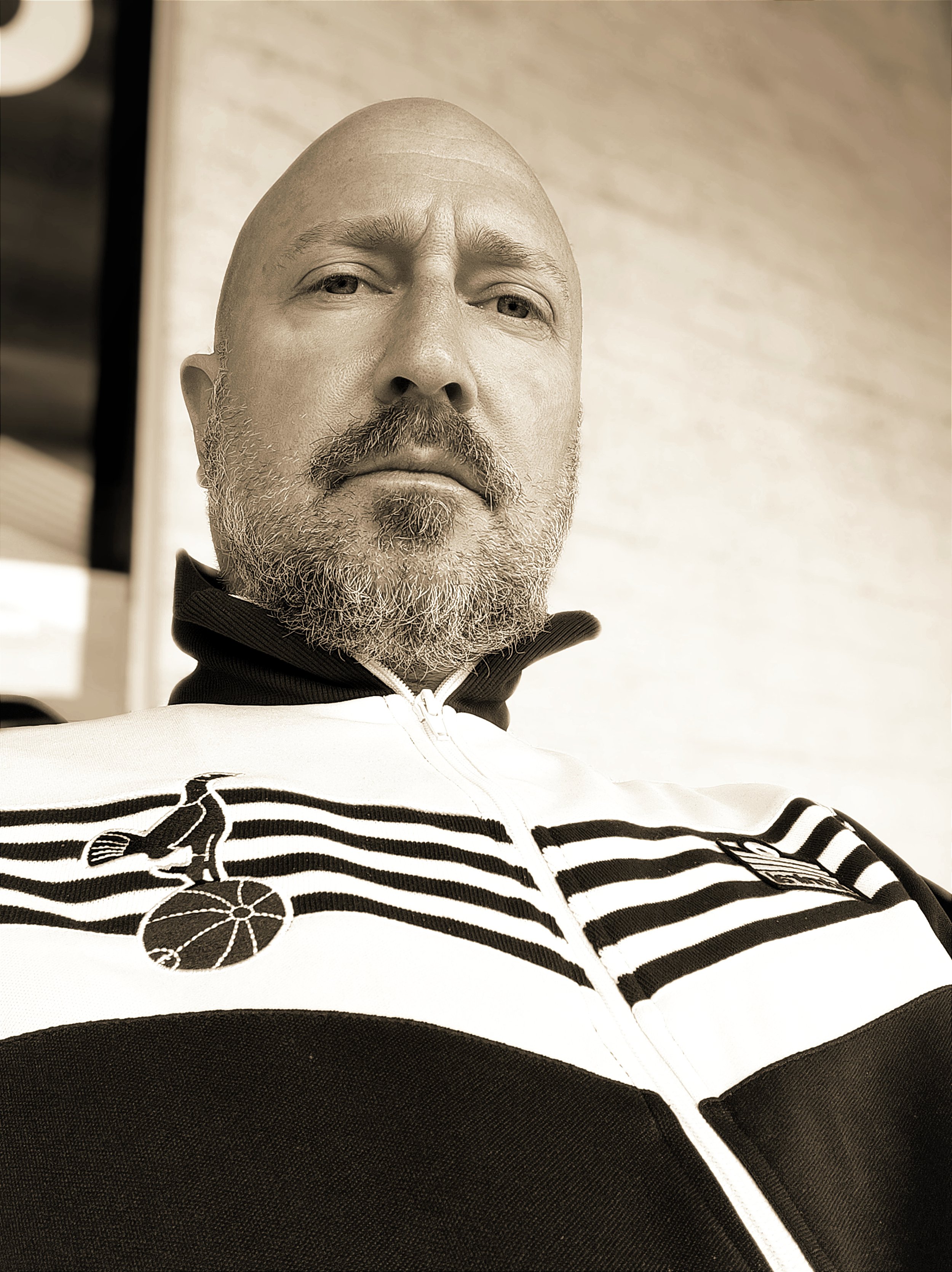 Simon, the owner and filmmaker at Racing Snake Media, in a classic Tottenham Hotspur tracksuit. Simon is behind the Life Goals documentary film.