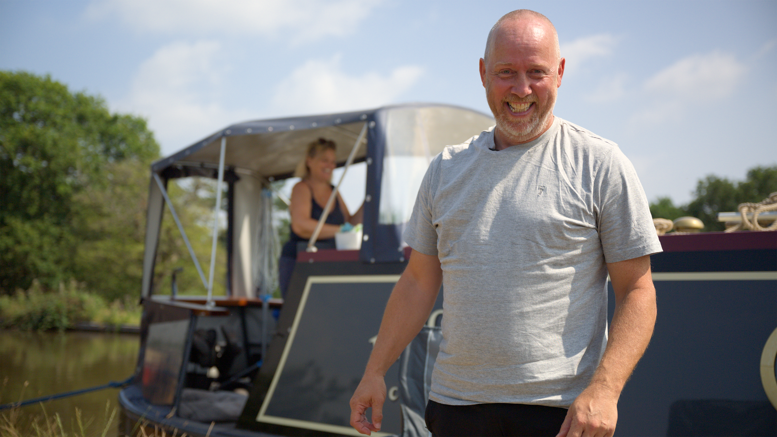Tony Potts, former Tottenham FA Youth Cup winner, stands in front of his narrow boat on the Shropshire Union Canal after being interviewed by Simon Sloan of Racing Snake Media for the Life Goals Documentary about Andy Turner.