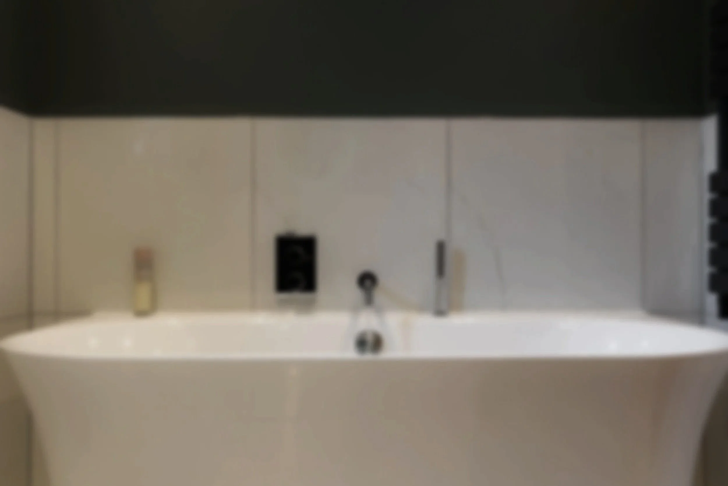 Close-up view of an electrical panel with multiple circuit breakers and wiring.