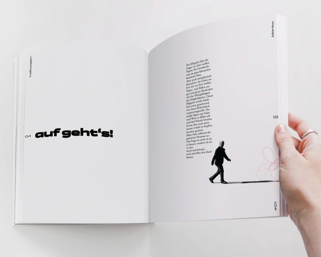 Offene Zeitschrift mit schwarzem Text "auf geht's!" auf der linken Seite und auf der rechten Seite ein Schwarz-Weiß-Bild eines gehenden Mannes, mit einem Textblock oberhalb.
