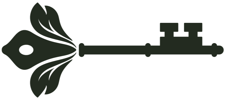 Silhouette of a fish with floral designs on its side attached to a key.