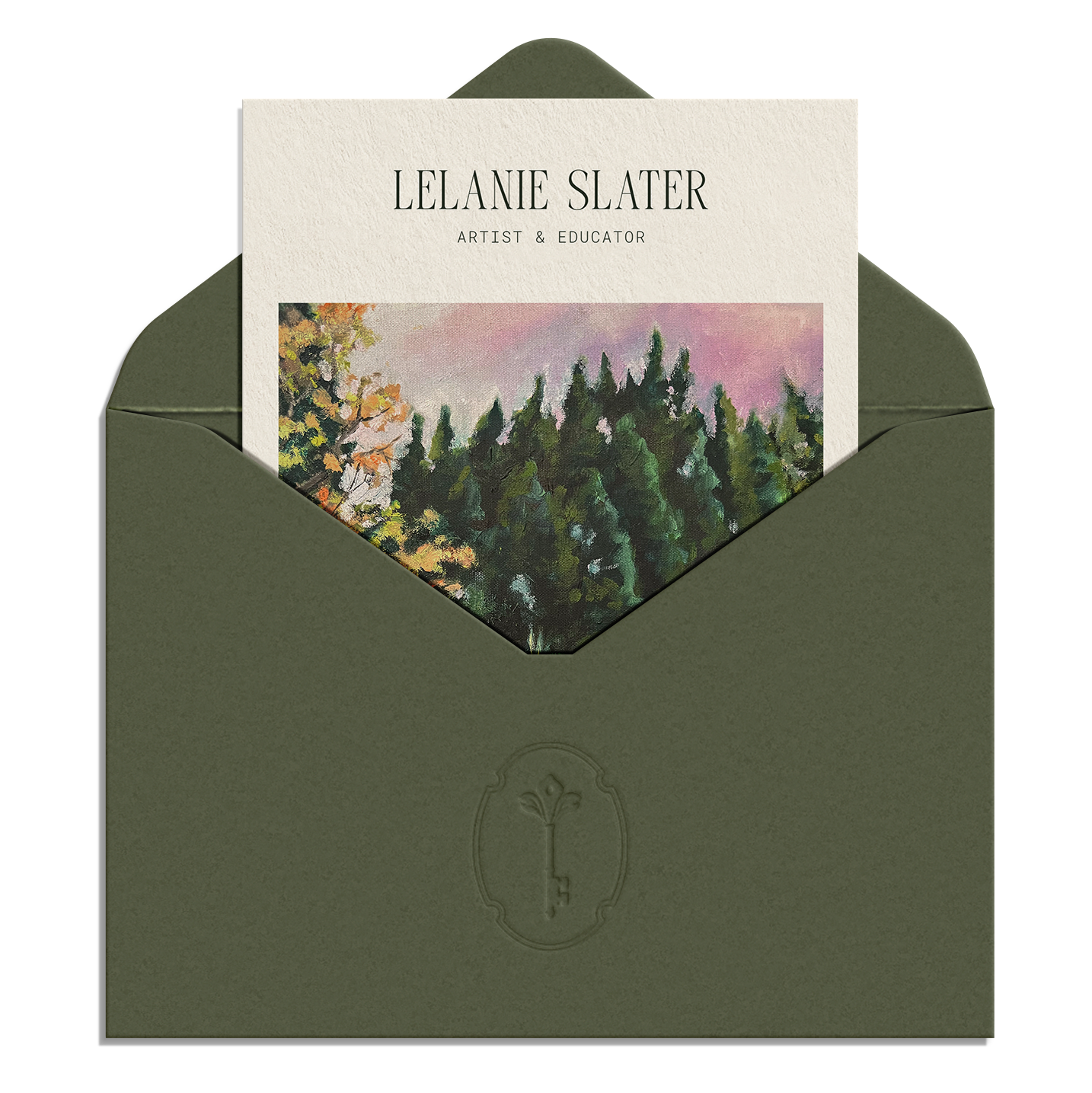 Green envelope with a business card partially visible, featuring a landscape painting of trees and a pink sky, showing the name 'Lelanie Slater' and the title 'Artist & Educator'.