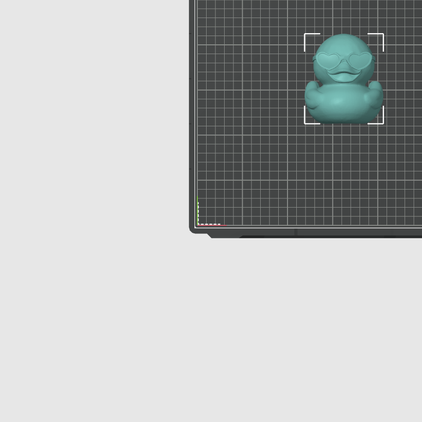 3D rubber duck with sunglasses on a 3D modeling grid in a computer design software.