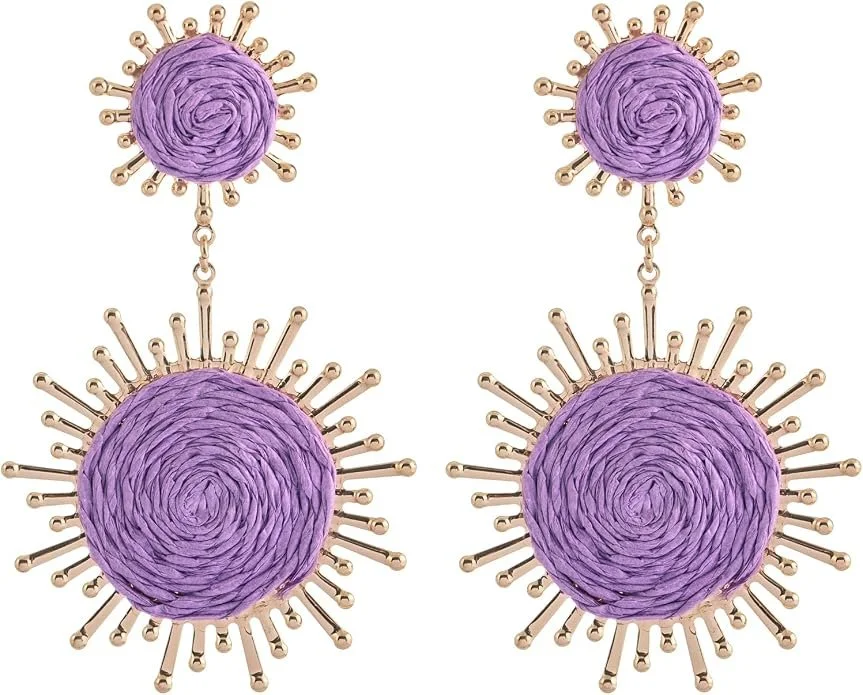 Set of two pairs of earrings featuring purple woven thread central circles with gold sunburst spiked designs.