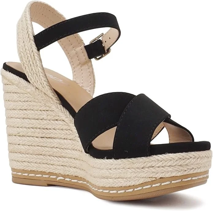 Black and beige espadrille wedge sandal with ankle strap and open toe, featuring thick braided jute sole and heel.