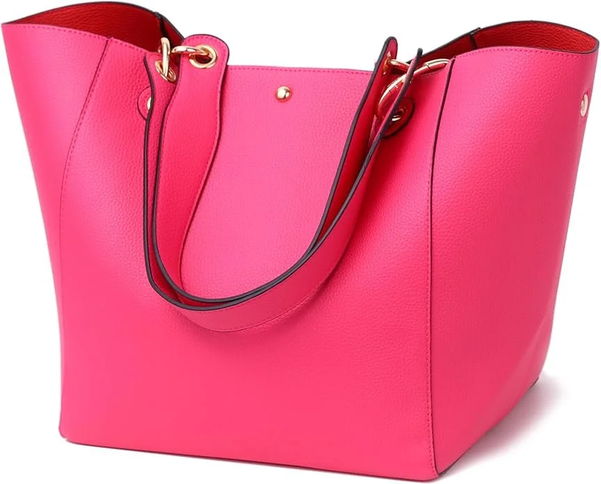 A large pink tote bag with black handles and gold hardware.