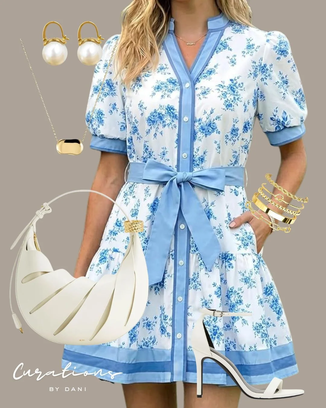 A woman wearing a blue and white floral dress with a waist tie, surrounded by gold and white jewelry including earrings, necklaces, bracelets, and rings, paired with white high-heeled sandals, a white crescent-shaped handbag, and some jewelry accessories, all set against a plain background.