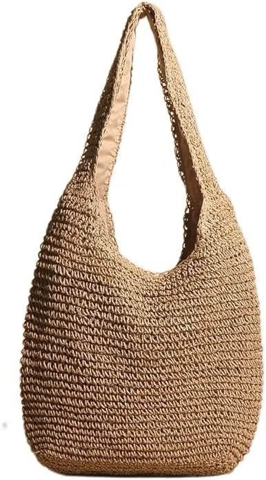 A beige, crocheted shoulder bag with a rounded shape and a single strap.