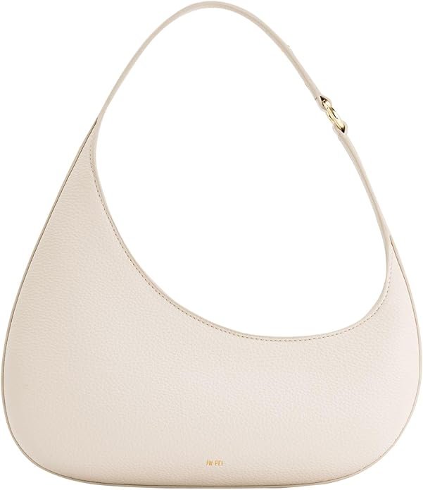 Beige crescent-shaped shoulder bag with a textured surface and a gold logo near the bottom, featuring a single handle with a gold clasp.