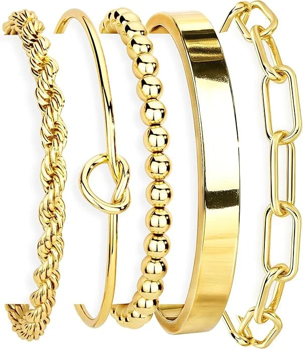 Five gold bracelets with different designs displayed side by side.