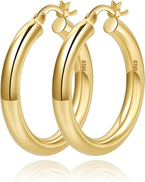 Pair of gold hoop earrings with a small ball detail at the hinge