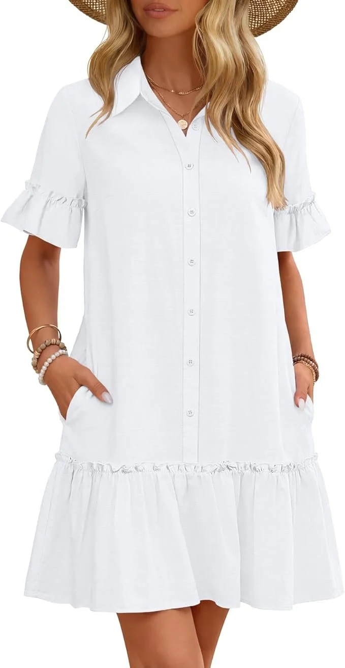 Woman wearing a white button-down dress with ruffled sleeves and a ruffled hem, accessorized with layered necklaces and bracelets, and a wide-brimmed straw hat.