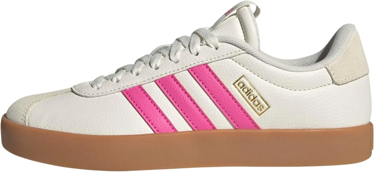 A white Adidas skate-style shoe with pink stripes, gold Adidas logo, and a tan sole.