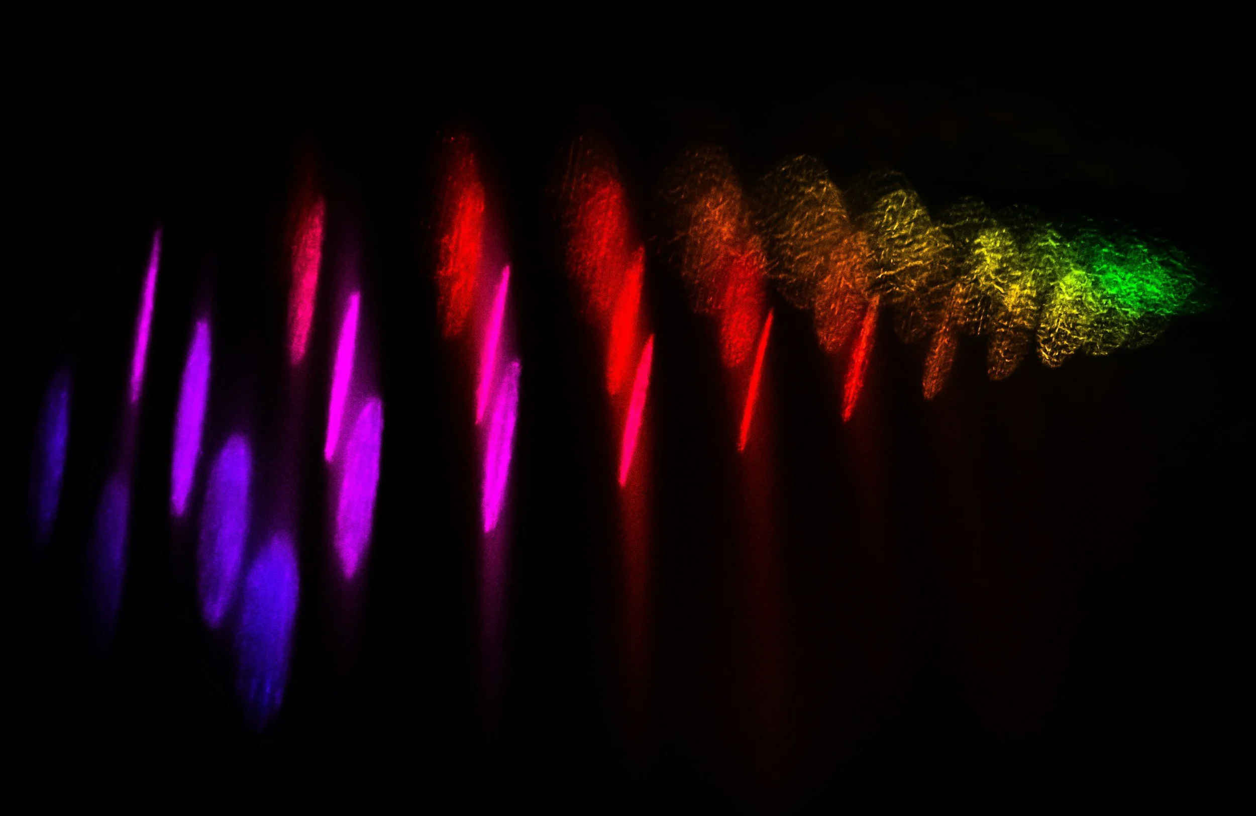 Colorful spectral light pattern representing Raman spectroscopy.
