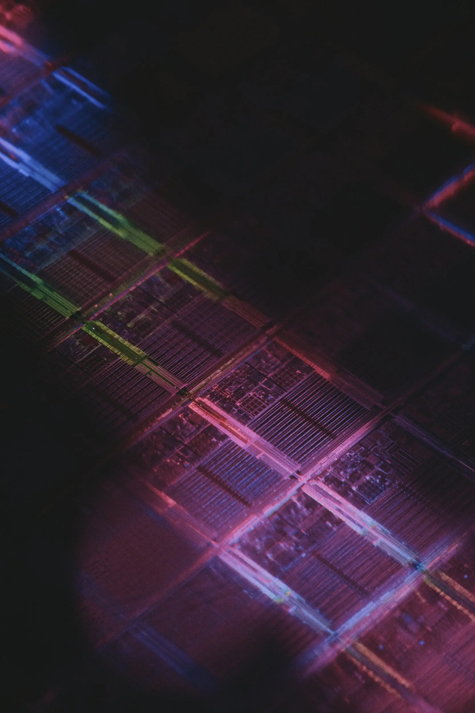 Illuminated semiconductor microchip representing material characterization.
