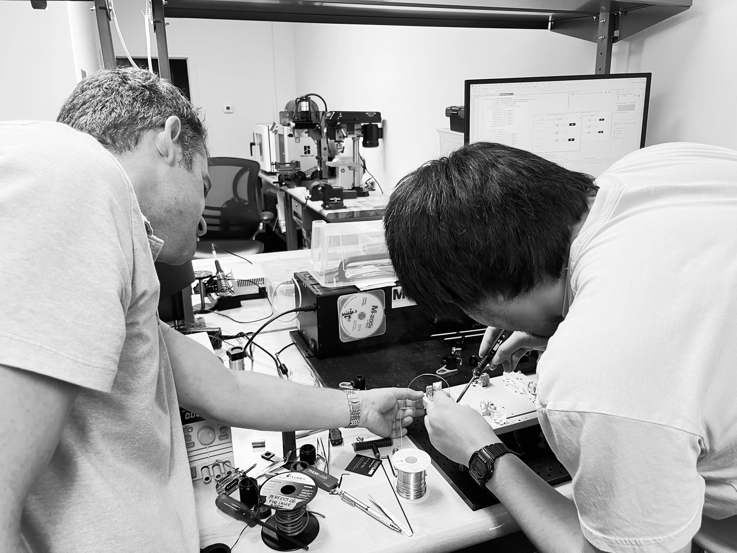 AB Photonics engineers assembling and testing optical equipment.