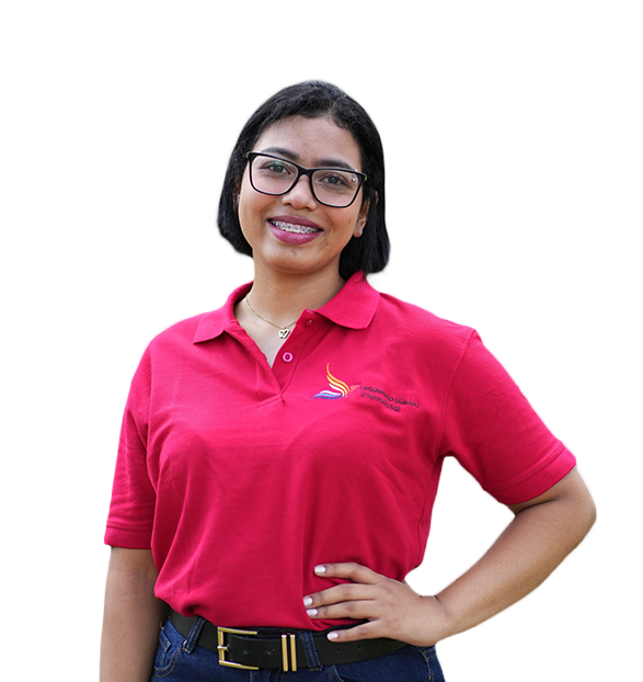 A Honduran woman wearing glasses and a pink polo shirt with a logo, smiling, with her hand on her hip, standing against a colorful abstract background.