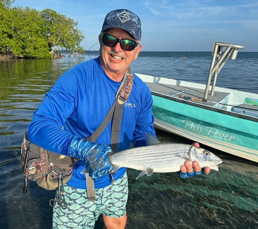 Fly fishing for bonefish in Belize at Tarpon Caye Lodge.