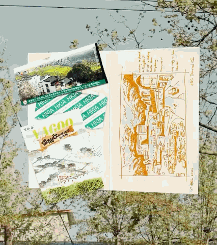 Open sketchbook with a pencil drawing of a street scene, surrounded by souvenir brochures and a rolled-up piece of paper, on tree branches during daytime.