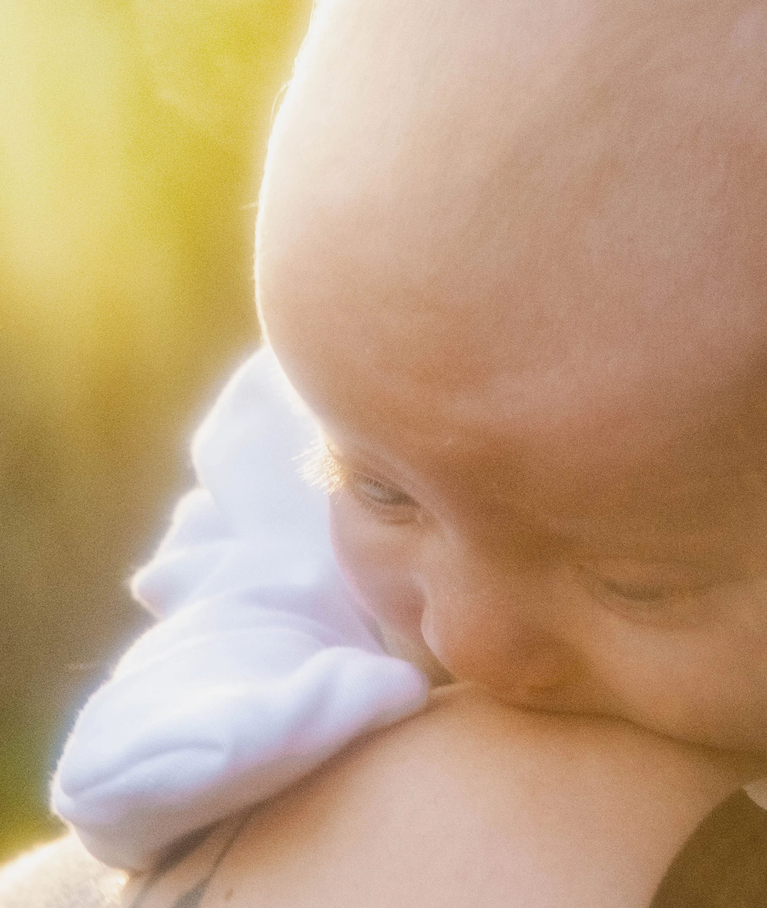Close-up of a person's skin, possibly facial, with smooth texture and soft lighting.